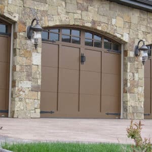 three sets of carriage house garage doors