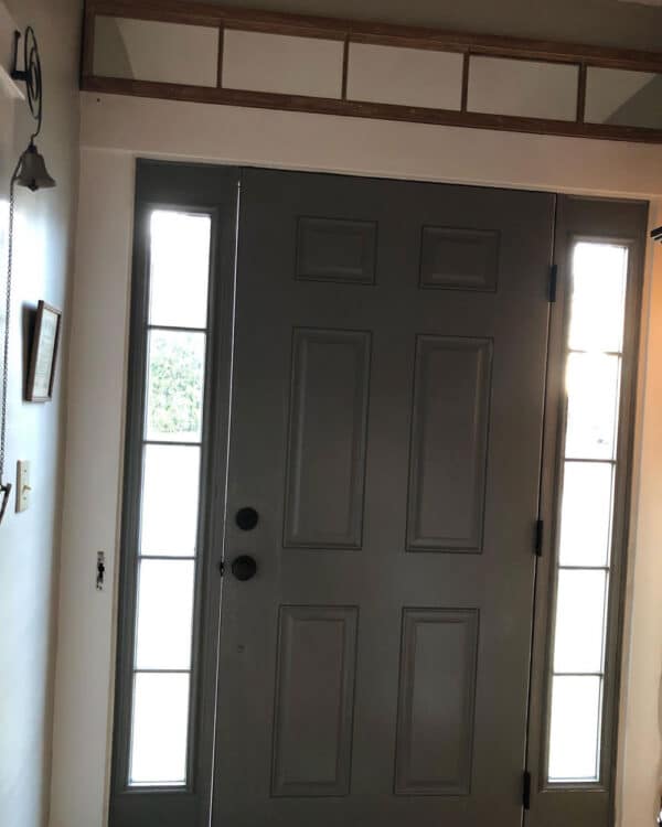 dark gray door with black knobs