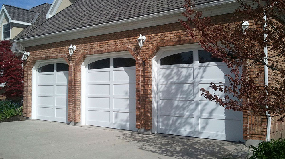 three white carriage house garage doors