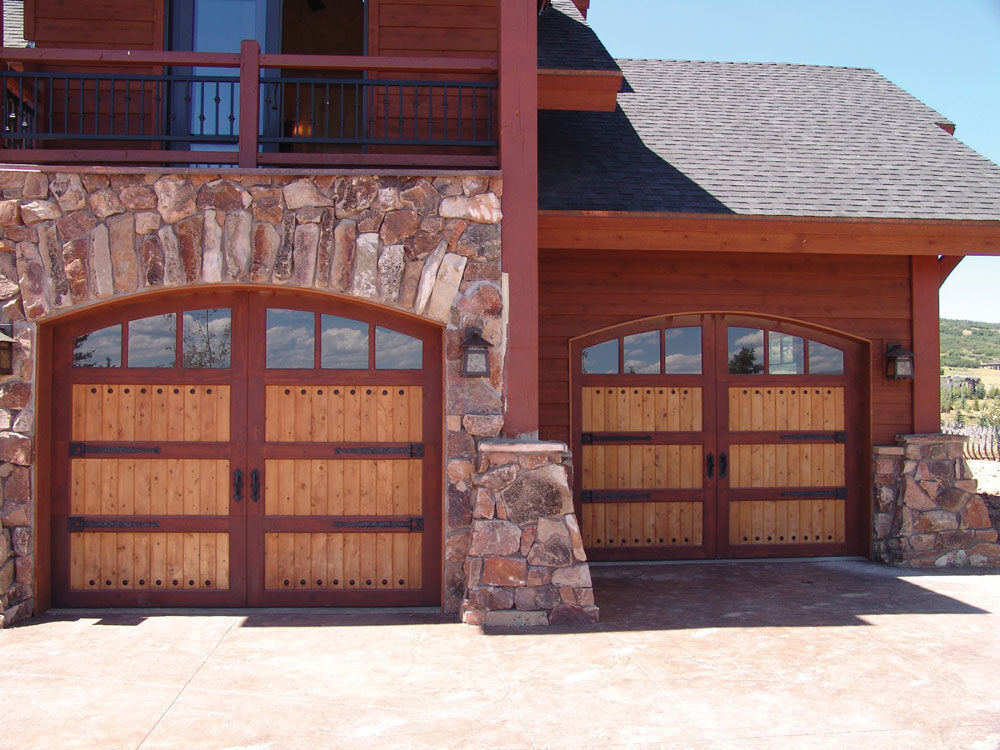 arched wooden carriage house doors